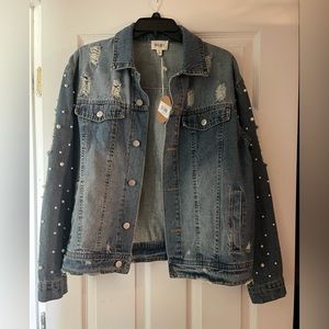 Denim jacket with pearl accents on sleeves